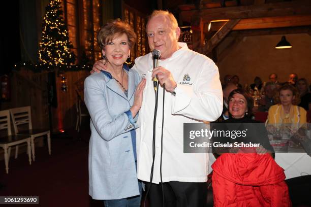 Carolin Reiber and Alfons Schuhbeck sings "sweet Caroline" during the Gut Aiderbichl Christmas Market opening on November 13, 2018 in Henndorf am...
