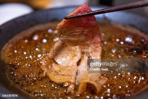 traditional japanese food, sukiyaki hot pot boiled, cooked beef, beef shabu shabu - sukiyaki stock-fotos und bilder