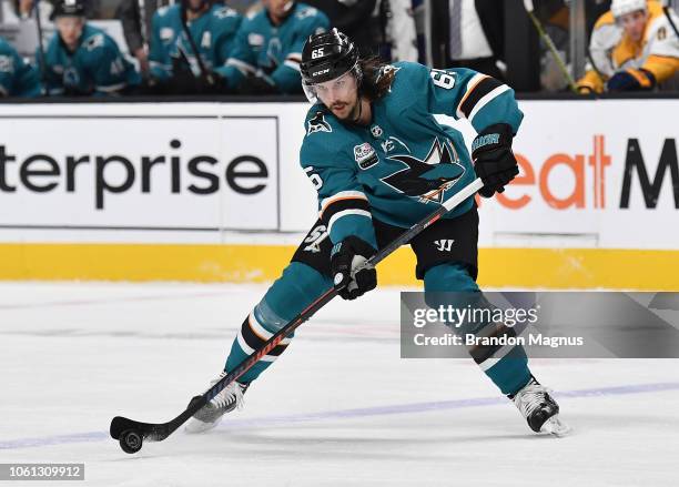 Erik Karlsson of the San Jose Sharks passes the puck ahead against the Nashville Predators at SAP Center on November 13, 2018 in San Jose, California