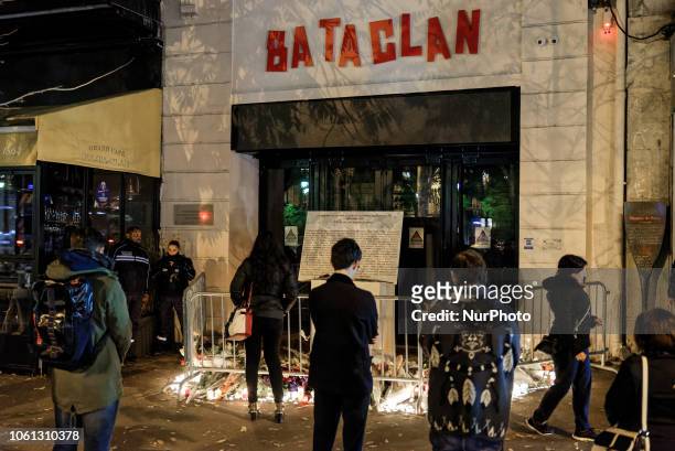 In the evening of november 13th, several people in front of the entrance of the Bataclan concert hall and the commemorative plaque for the victims of...