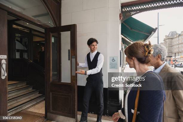 we hope you enjoy your stay - bellhop stock pictures, royalty-free photos & images