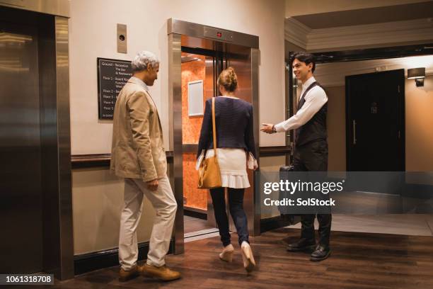 after you - elevator doors stock pictures, royalty-free photos & images