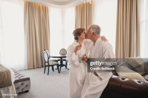 happy anniversary celebration in hotel - kissing mouth stock pictures, royalty-free photos & images