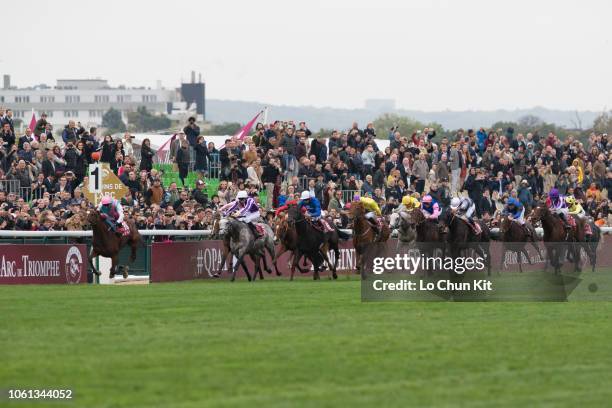 Jockeys compete the Race 4 Qatar Prix de l'Arc de Triomphe at ParisLongchamp racecourse on October 7, 2018 in Paris, France.
