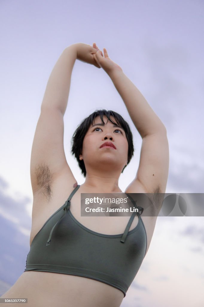 Natural portrait of woman with armpit hair