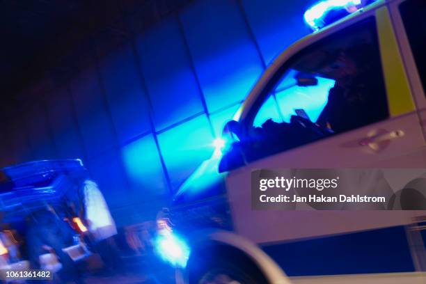 police officer investigating a car - sweden police fotografías e imágenes de stock