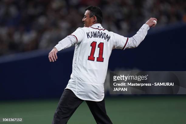 Former baseball player Kenshin Kawakami throws a ceremonial first pitch prior to the game five between Japan and MLB All Stars at Nagoya Dome on...