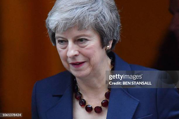 Britain's Prime Minister Theresa May leaves 10 Downing Street in London on November 14 to attend the weekly Prime Minister's Questions at the Houses...