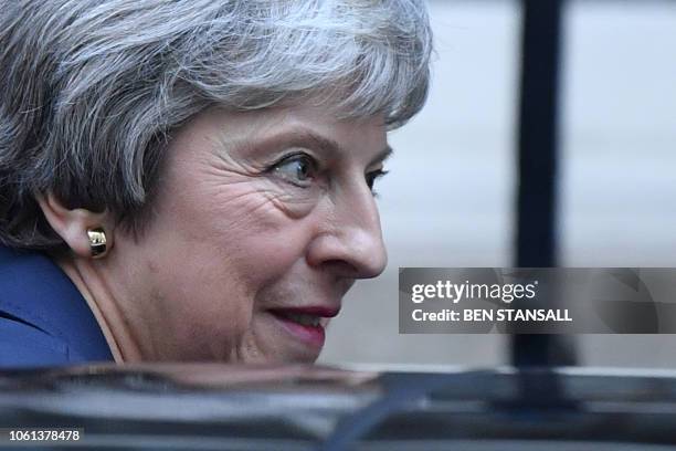 Britain's Prime Minister Theresa May leaves 10 Downing Street in London on November 14 to attend the weekly Prime Minister's Questions at the Houses...