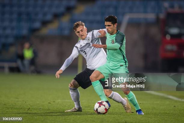 Alexander Lungwitz of Germany and Pedro Lomba Neto of Portugal battle for the ball during the Germany U19 against Portugal U19 match of UEFA Four...