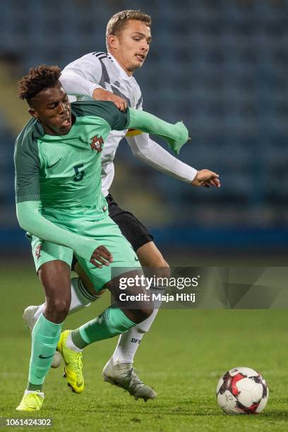 Jann-Fiete Arp of Germany is challenged by Nuno Albertino Varela Tavares of Portugal during the Germany U19 against Portugal U19 match of UEFA Four...