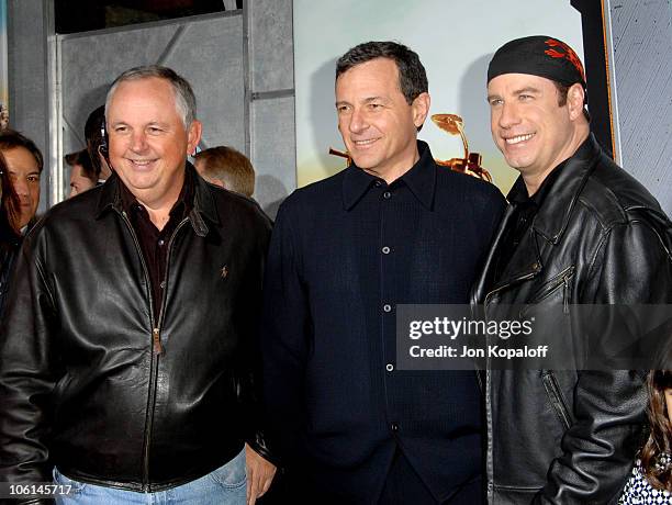 Disney's Dick Cook, Disney's Robert A. Iger and John Travolta