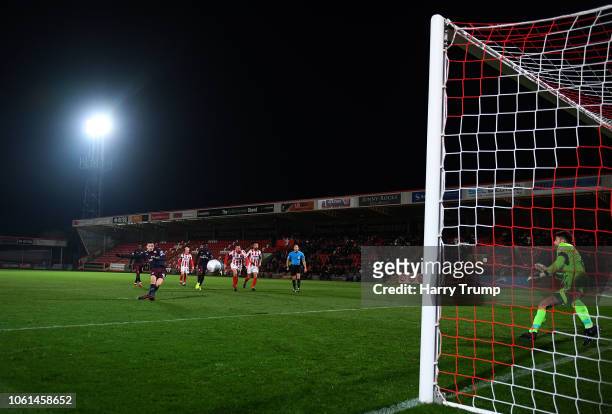 Charlie Gilmour of Arsenal U21 scores his sides second goal during the Checkatrade Trophy match between Cheltenham Town and Arsenal U21 at Whaddon...