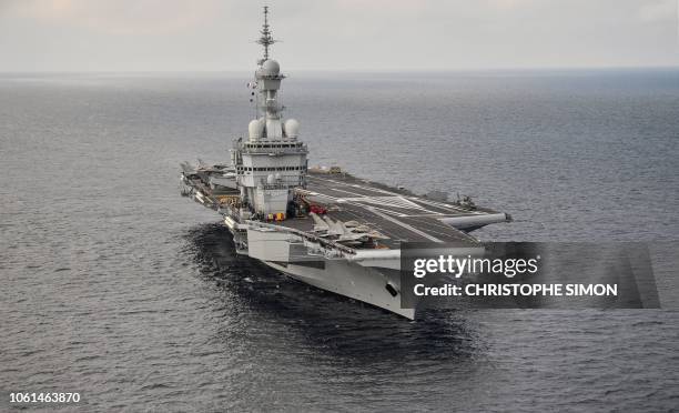 Picture taken on November 14, 2018 shows the upgraded Charles de Gaulle aircraft carrier off the coast of Toulon, southern France. - The French...