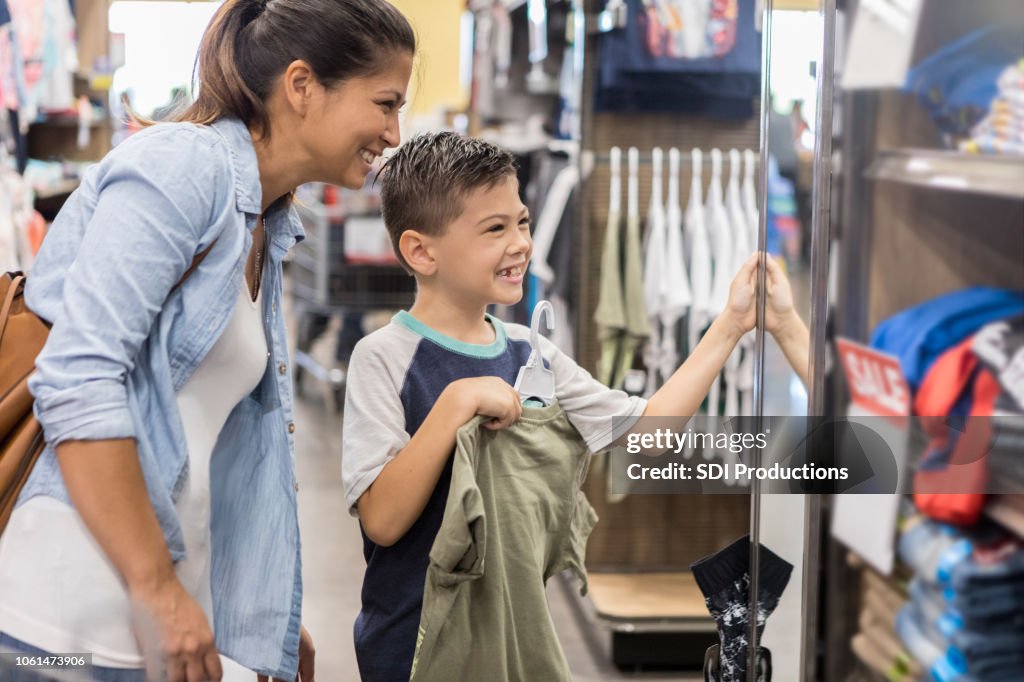 A mother and son shop for new clothes after school