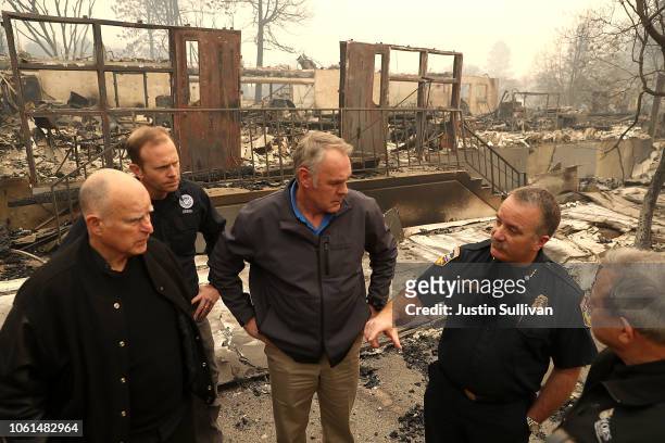 California Governor Jerry Brown, FEMA Administrator Brock Long and U.S. Secretary of the Interior Ryan Zinke tour a school burned by the Camp Fire on...