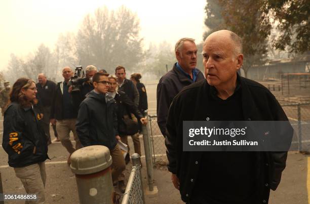 California Governor Jerry Brown and U.S. Secretary of the Interior Ryan Zinke tour a school burned by the Camp Fire on November 14, 2018 in Paradise,...