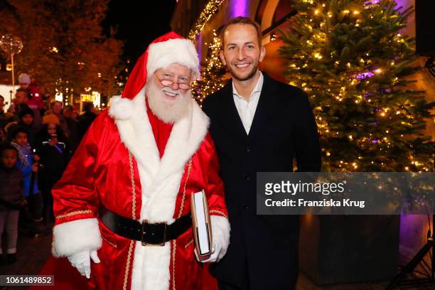 Santa Claus and Store Manager KaDeWe Timo Weber during the Christmas gallery opening at KaDeWe on November 14, 2018 in Berlin, Germany.