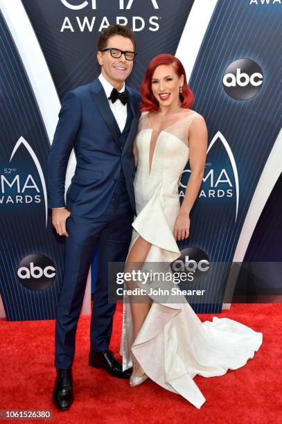 Radio personality Bobby Bones and Ballroom dancer Sharna Burgess attend the 52nd annual CMA Awards at the Bridgestone Arena on November 14, 2018 in...