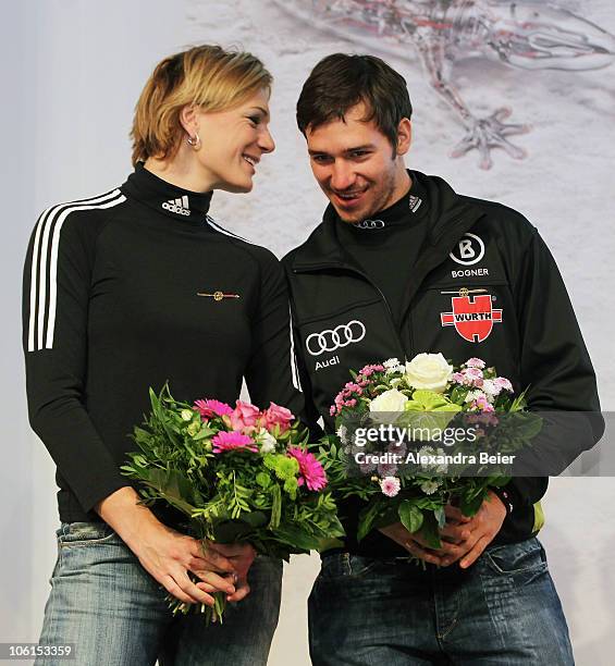 German alpine skiers Maria Riesch and Felix Neureuther chat after they received the 'Golden Ski ' award given from the German Ski Federation to their...