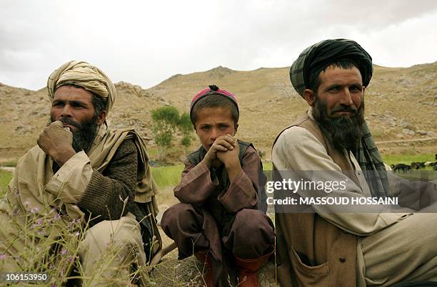 Afghanistan-unrest-ethnic-land,FEATURE BY Thibauld Malterre Afghan Nomads pose in a field in Behsud, some 150 kilometres east of Kabul on July 25,...