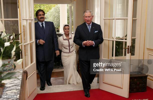 His Highness the Emir of the State of Qatar, Sheikh Hamad bin Khalifa Al Thani and his wife, Sheikha Mozah bint Nasser Al-Missned follow Prince...