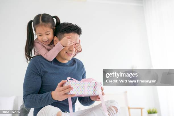 father's day. happy family daughter hugging dad and laughs on holiday - 父の日 ストックフォトと画像