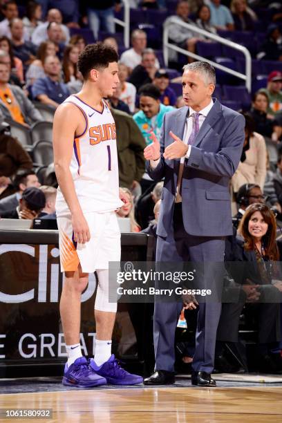 Head Coach Igor Kokoskov of the Phoenix Suns speaks with Devin Booker during the game against the San Antonio Spurs on November 14, 2018 at Talking...