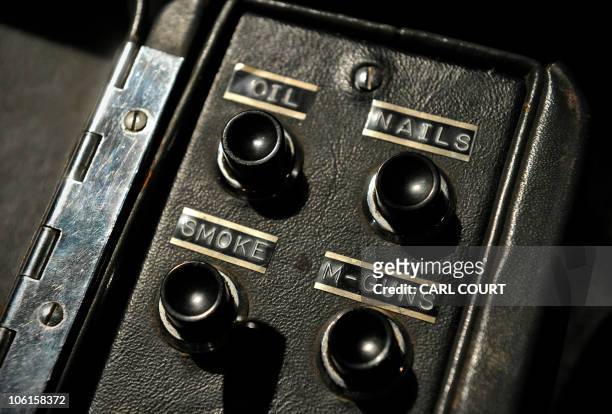 Gadget switches are pictured inside a 1964 Aston Martin DB5 vehicle used by British actor Sean Connery when he played fictional spy charachter James...