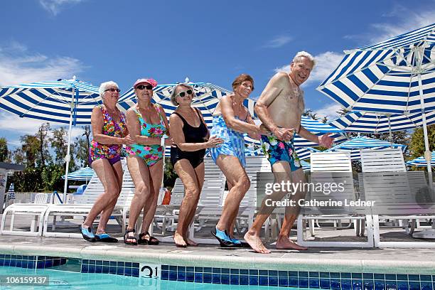 group of seniors dancing by the pool - altadena stockfoto's en -beelden