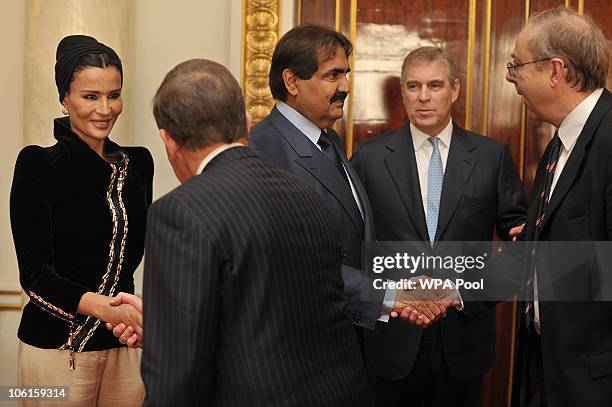 Britain's Prince Andrew introduces the Emir of Qatar, Sheikh Hamad bin Khalifa al-Thani and his wife Sheikha Mozah to ministers ahead of a meeting at...