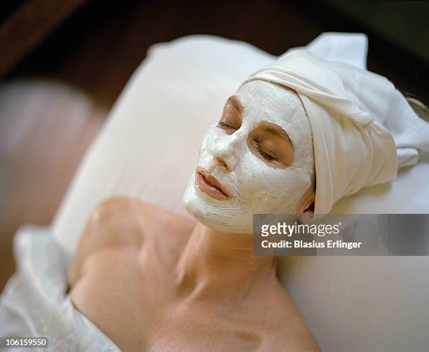 facial with white mask - beautiful woman spa stock pictures, royalty-free photos & images