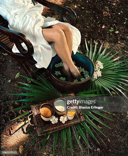 feet in flower water - essence day stock pictures, royalty-free photos & images