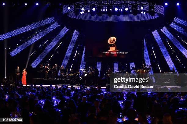 Jaime Camil and host Soledad Pastorutti speak onstage at the Person of the Year Gala honoring Mana during the 19th annual Latin GRAMMY Awards at the...