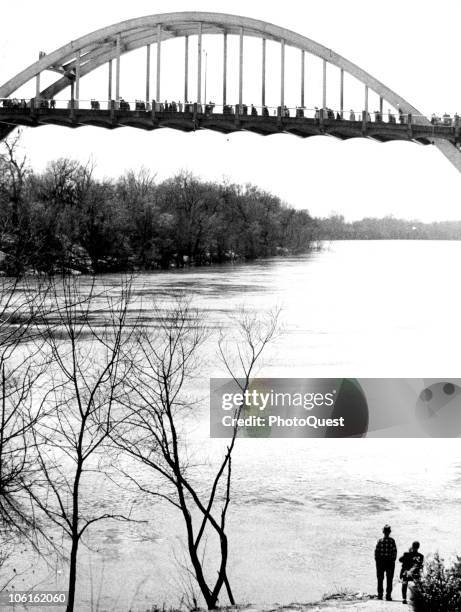 View of the Edmund Pettus Bridge across the Alabama river as it is crossed by thousands of Civil Rights demonstrators during the third Selma to...