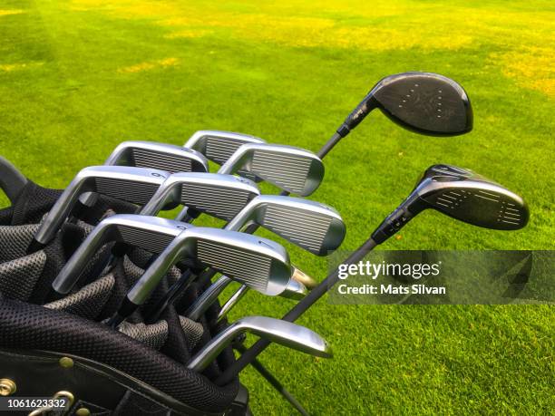 professional golf bag with a set of forged blades golf clubs - golf club stock pictures, royalty-free photos & images