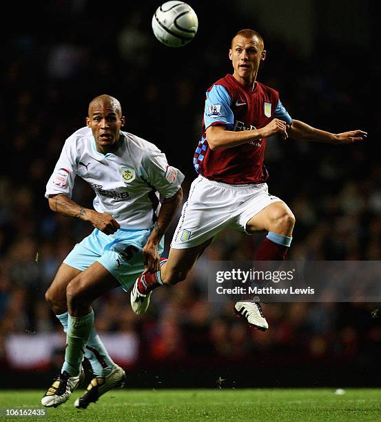 Steve Sidwell of Aston Villa and Clarke Carlisle of Burnley challenge for the ball during the Carling Cup Fourth Round match between Aston Villa and...