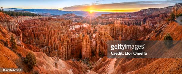 big panoramic photo of sunrise in bryce canyon national park. utah, usa. - utah landscape stock pictures, royalty-free photos & images