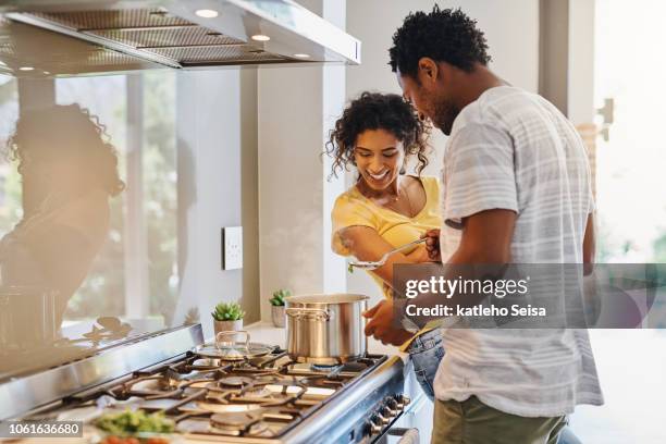 let's have a taste - couple in kitchen stock pictures, royalty-free photos & images