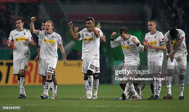 The team of Gladbach celebrates after winning the DFB Cup match between Borussia M'gladbach and Bayer Leverkusen at Borussia Park on October 27, 2010...