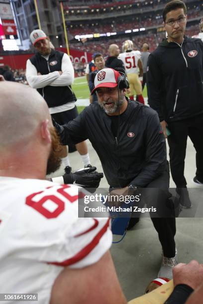 Offensive Line Coach John Benton and Erik Magnuson of the San Francisco 49ers talk on the sideline during the game against the Arizona Cardinals at...