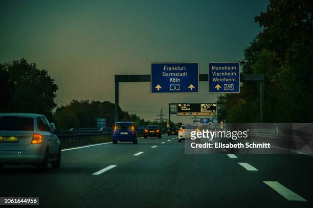 traffic on german motorway ("autobahn") in the evening - autobahn - fotografias e filmes do acervo