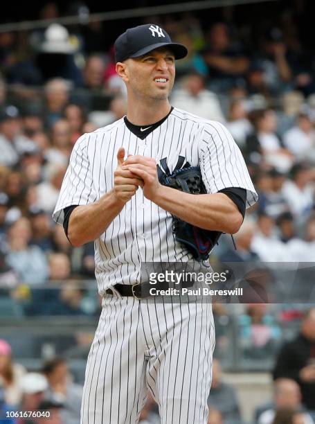 Pitcher J.A. Happ of the New York Yankees reacts after giving up a home run in the second inning in an MLB baseball game against the Baltimore...