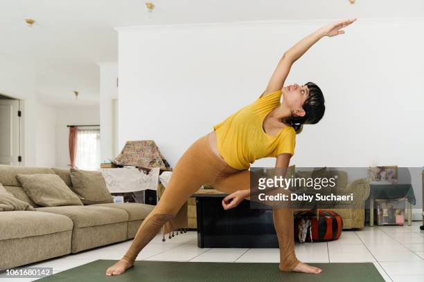 Pregnant woman doing stretching and yoga