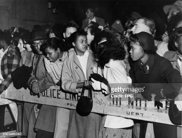 Crowds of Brooklyn Dodgers fans greet the team at Pennsylvania Station in New York City, as they arrive from Philadelphia after winning the National...