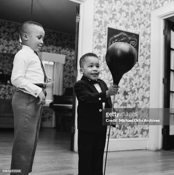 Martin Luther King III and Dexter , the sons of civil rights activist Martin Luther King Jr. And his wife Coretta Scott King, February 1964.