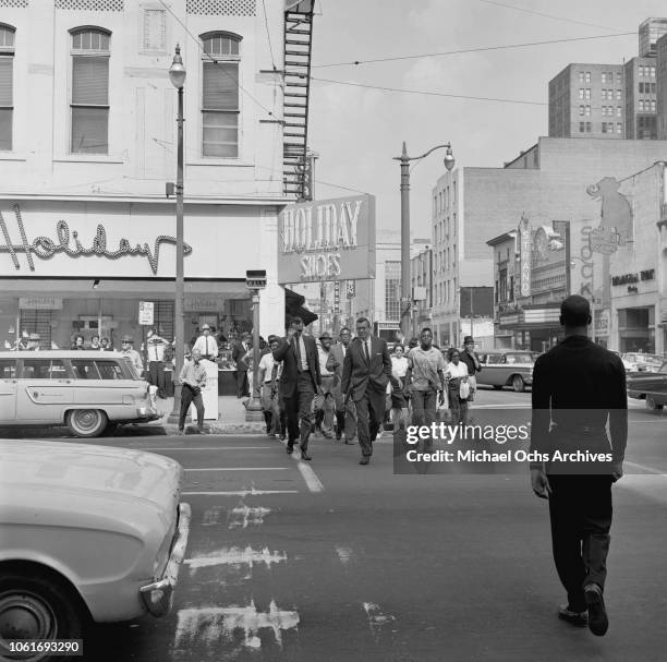 Protestors crossing a street during the Birmingham Campaign in Birmingham, Alabama, May 1963. The movement, which called for the integration of...