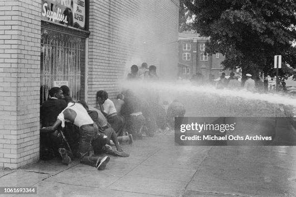 Fire fighters use fire hoses to subdue the protestors during the Birmingham Campaign in Birmingham, Alabama, May 1963. The movement, which called for...