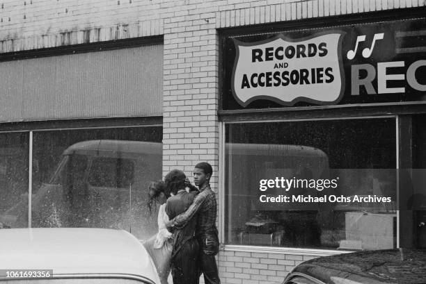 Fire fighters use fire hoses to subdue the protestors during the Birmingham Campaign in Birmingham, Alabama, May 1963. The movement, which called for...