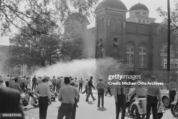 Police officers and fire fighters are called to quell unrest at the 16th Street Baptist Church, headquarters of the Birmingham Campaign in...